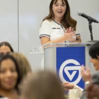 Emily Spranger speaking from podium